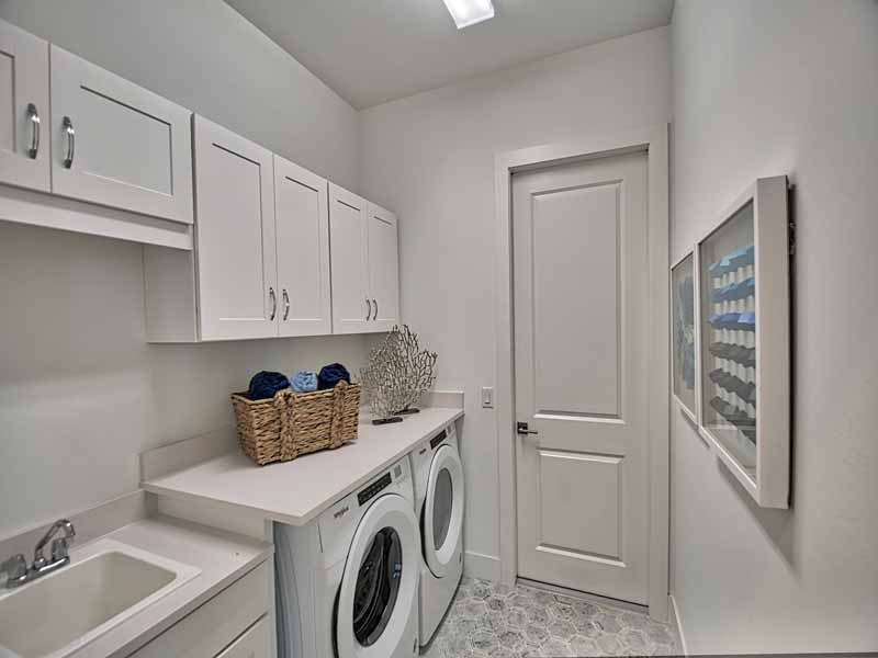 Design laundry room with Cleope washer and dryer door